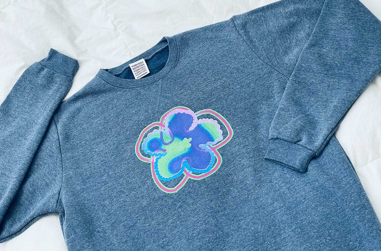 BLUSHED BUTTERCUP NAVY HEATHER CREWNECK
